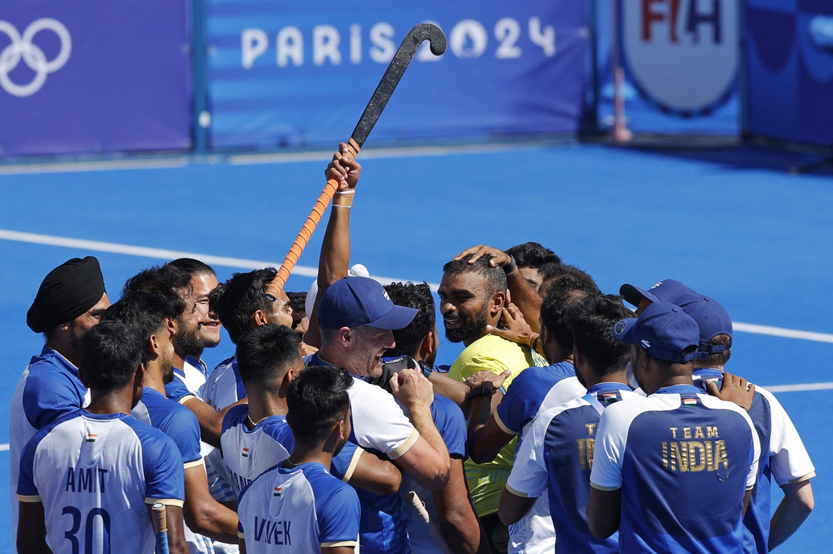 India's players celebrate after beating Spain and clinching the bronze medal. 