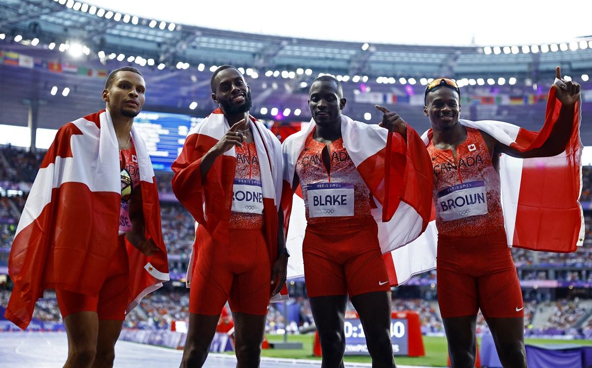 Canada's Brendon Rodney, Jerome Blake, Andre de Grasse and Aaron Brown celebrate after winning gold in the Olympics men's 4x100m Relay final at Stade de France, Paris, on Friday.