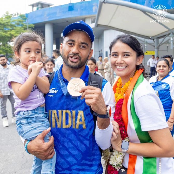 Manpreet Singh with his family on his arrival from the Paris Olympics on Saturday