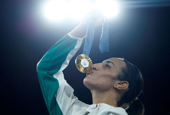 Algeria's Imane Khelif kisses her gold medal after the Olympics women's boxing 66kg victory ceremony at Roland-Garros Stadium, Paris, on Friday.