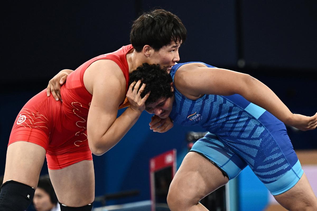 Aiperi Medet Kyzy of Kyrgyzstan in action with India's Reetika Hooda during their Olympic Wrestling Women's Freestyle 76kg quarter-final bout at Champ de Mars Arena, Paris, France, on Saturday