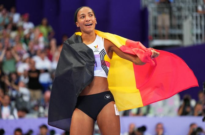 Belgium's Nafissatou Thiam celebrates with her national flag after winning gold in the women's Heptathlon.