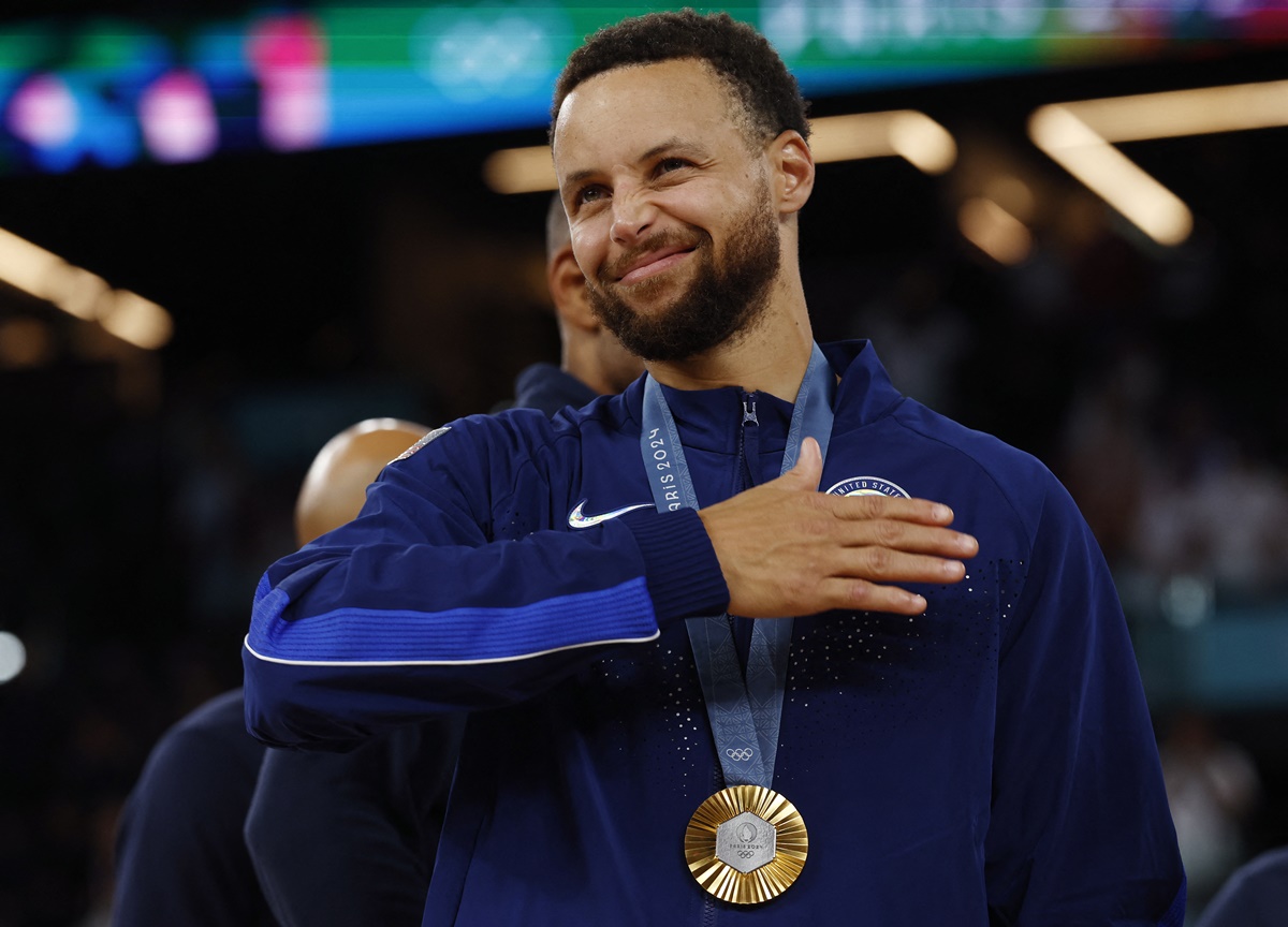 Stephen Curry reacts during the medal ceremony.