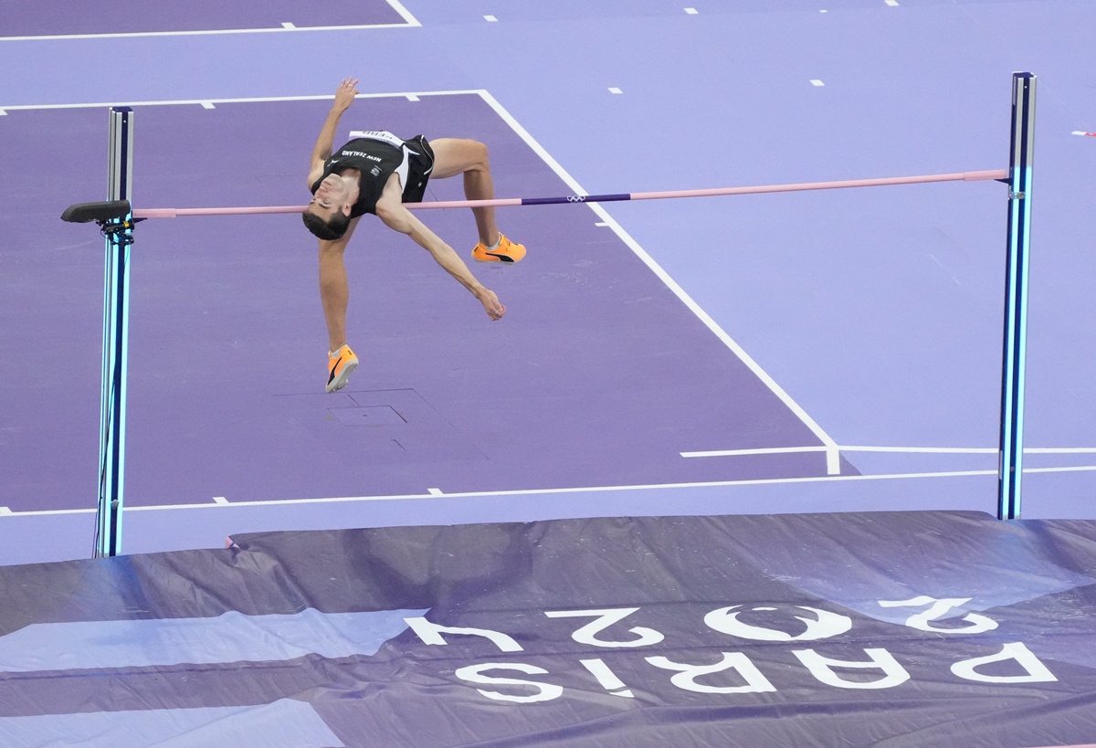 Hamish Kerr goes over the bar at 2.34m to clinch victory over silver medallist Shelby McEwen of the United States.