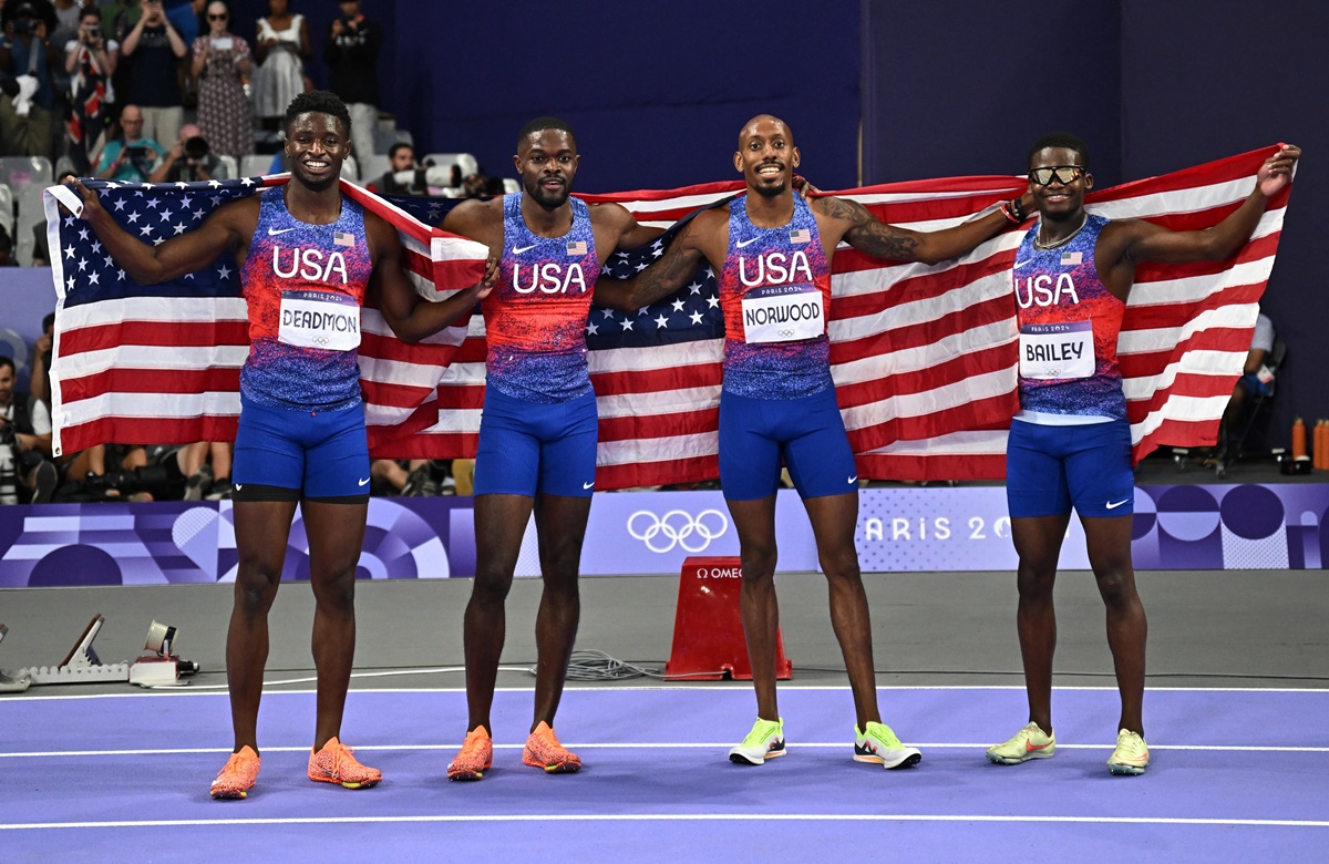 The United States quartet of Bryce Deadmon, Rai Benjamin, Vernon Norwood and Christopher Bailey celebrate winning gold in the Olympics men's 4x400m Relay final at Stade de France, Paris, on Saturday.