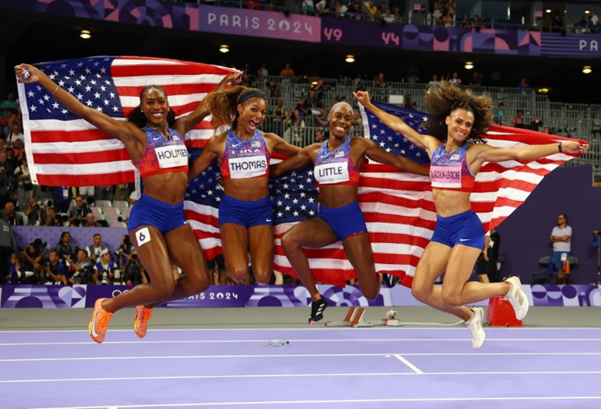 The United States team of Shamier Little, Sydney McLaughlin-Levrone, Gabrielle Thomas and Alexis Holmes celebrate winning winning gold in the women's 4x400m relay.