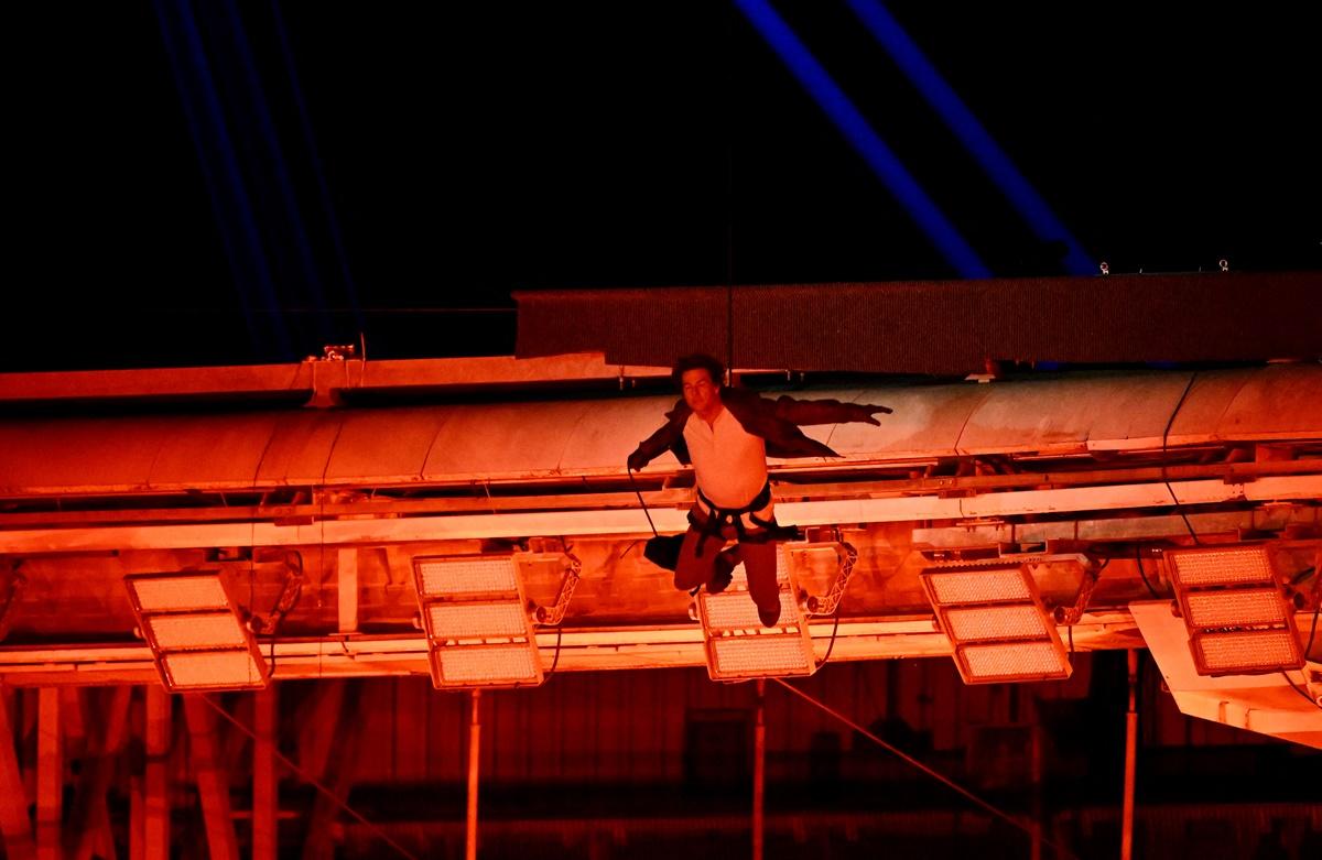 Actor Tom Cruise jumps from the roof of the Stade de France during the Olympics 2024 Closing Ceremony in Paris on Sunday.