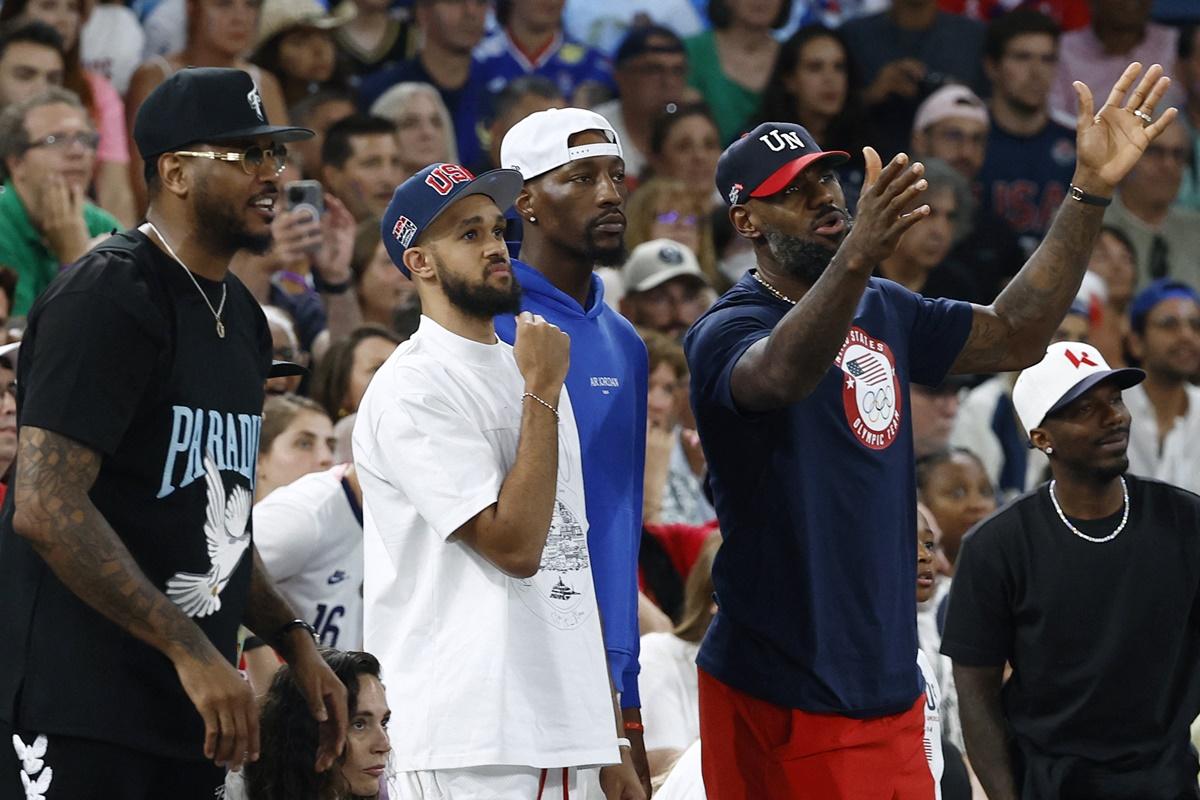 United States basketball stars Carmelo Anthony, Derrick White, Bam Adebayo and Lebron James watch the match.