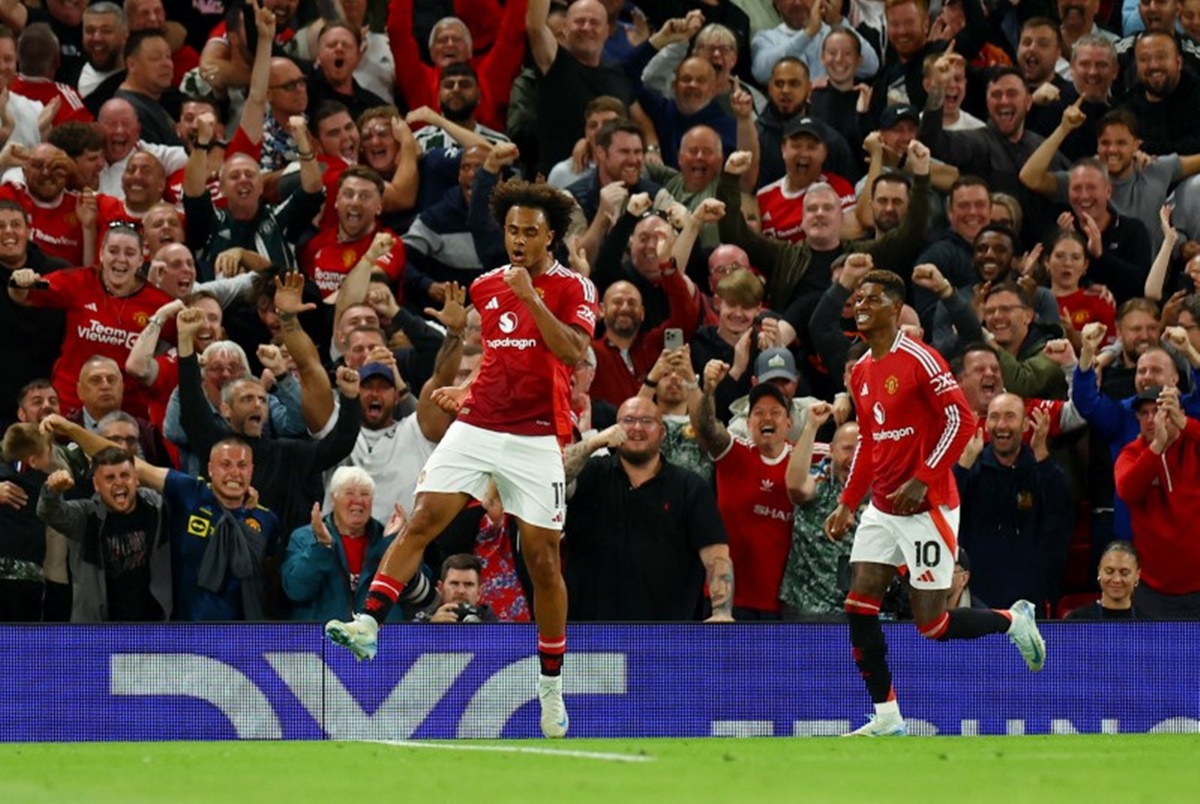 Joshua Zirkzee celebrates with Marcus Rashford after scoring on debut for Manchester United during the Premier League match against Fulham at Old Trafford, Manchester, on Friday.