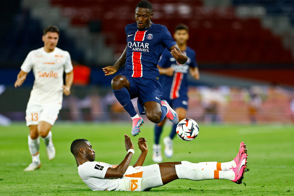 Paris St Germain's Nuno Mendes in action with Montpellier's Boubakar Kouyate during their Ligue 1 match at Parc des Princes, Paris, France, on Friday 