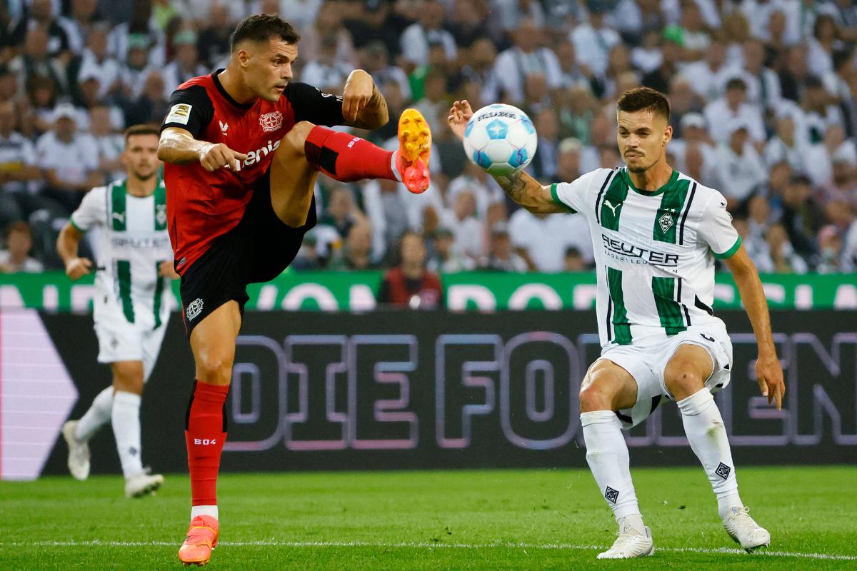 Bayer Leverkusen's Granit Xhaka in action with Borussia Moenchengladbach's Julian Weigl during their Bundesliga match at Borussia-Park, Moenchengladbach, Germany, on Friday