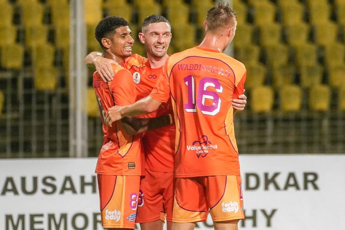 Brisbane Roar players celebrate the opening goal against Dempo FC in the opening match of the Bandodkar Trophy on Saturday