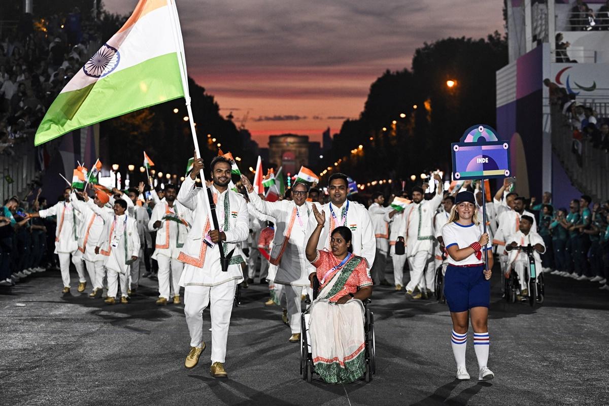 Flagbearers Bhagyashri Mahavrao Jadhav and Sumit Antil lead the Indian contingent during the opening ceremony.