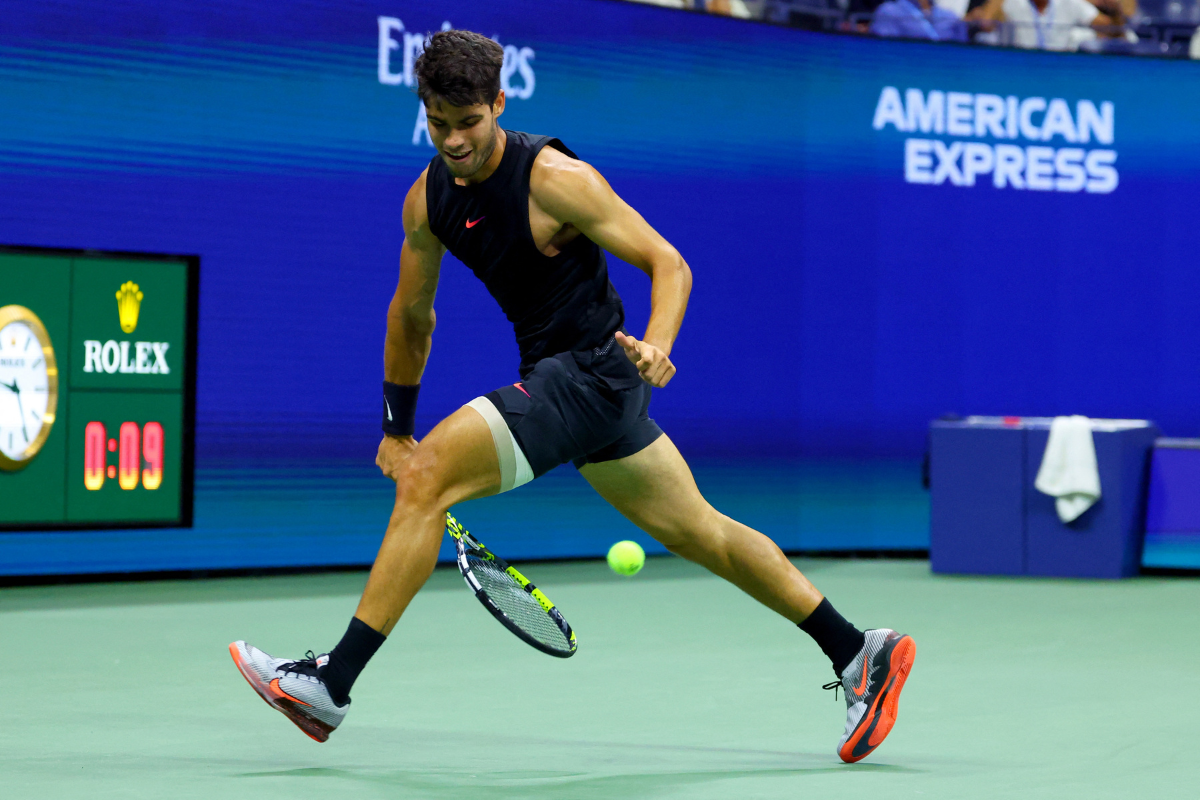 Spain's Carlos Alcaraz plays a 'tweener' during a second round match against Botic van de Zandschulp from the Netherlands at the US Open on Thursday