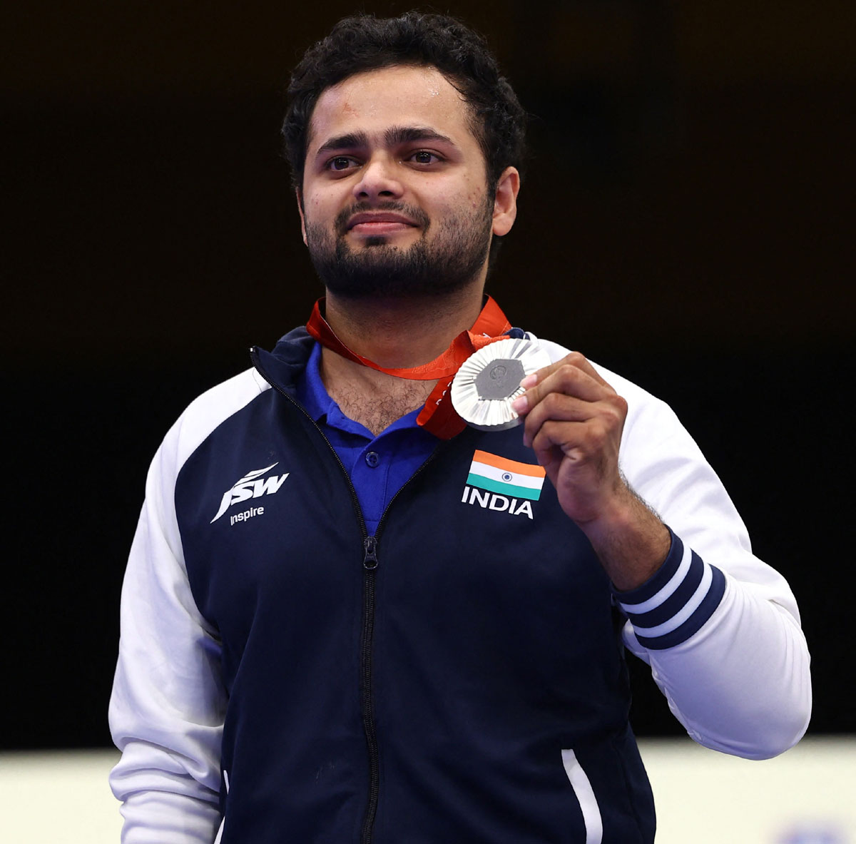 Manish Narwal of India poses with his silver medal at the Paris Paralympics on Friday