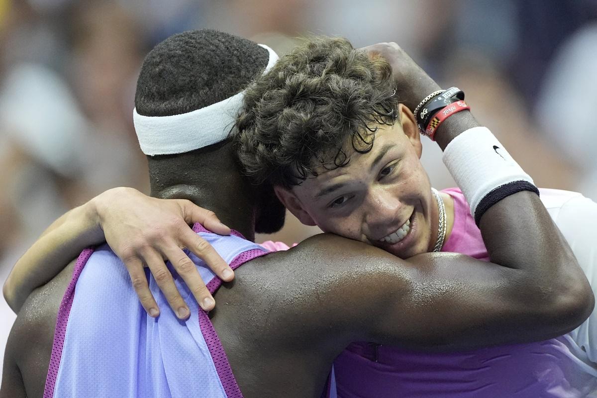 Frances Tiafoe embraces Ben Shelton at the net after the match.