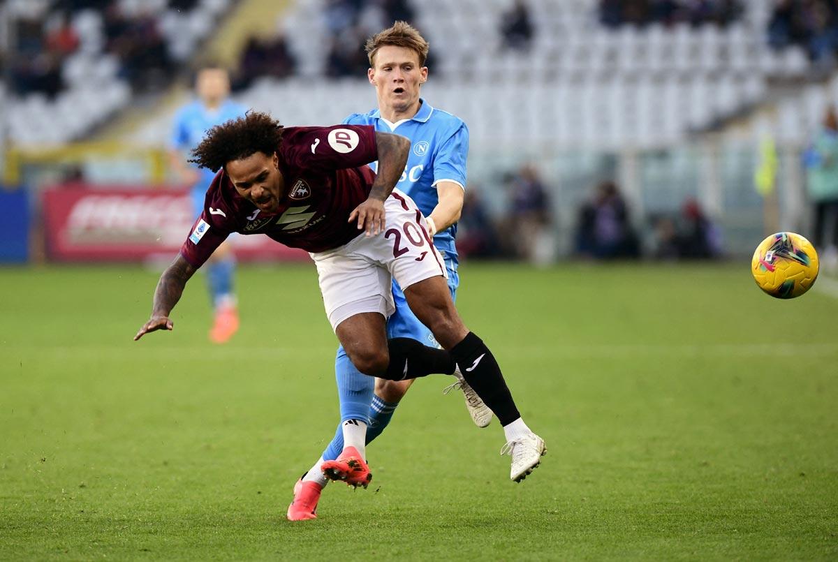 Scott McTominay in action with Torino's Valentino Lazaro