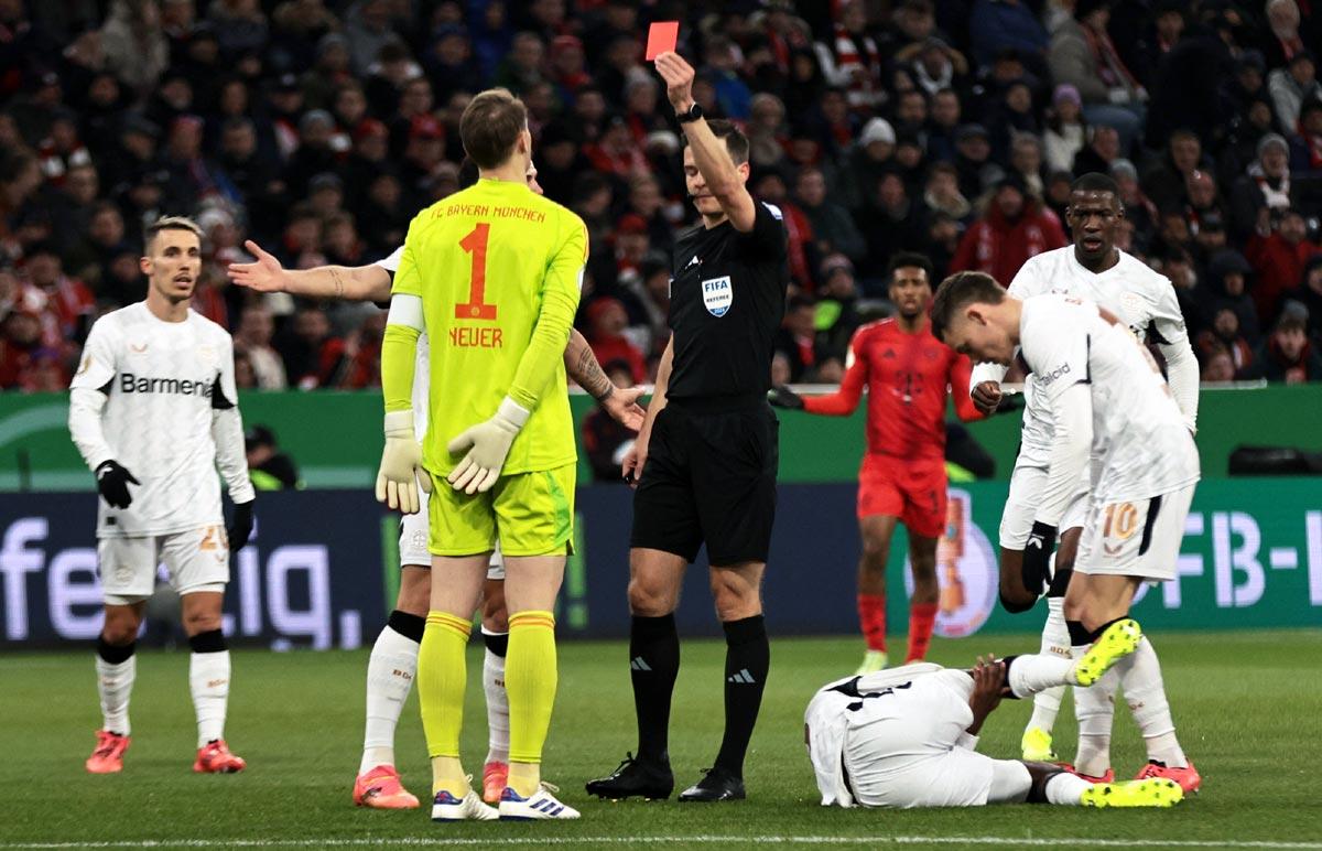 Bayern Munich's Manuel Neuer is shown a red card