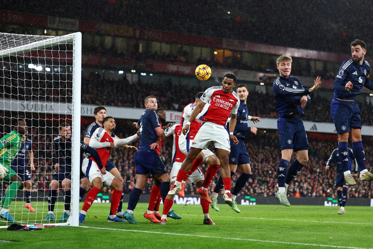 Arsenal's Jurrien Timber scores their first goal against Manchester United