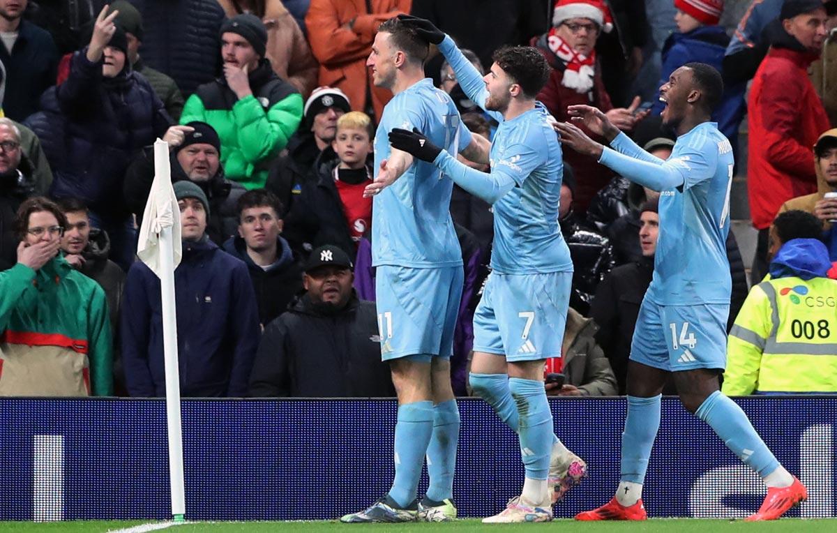 Chris Wood, left, celebrates scoring Nottingham Forest's third goal with teammates Neco Williams and Callum Hudson-Odoi.