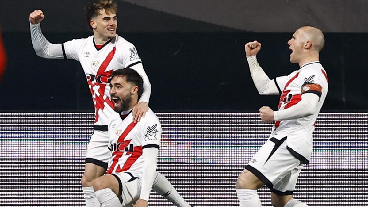 Unai Lopez celebrates with teammates after scoring Rayo Vallecano's first goal