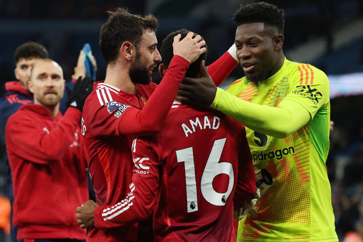 Manchester United's Amad Diallo, Bruno Fernandes and Andre Onana celebrate with after their win over Manchester City at the  Etihad Stadium, Manchester, Britain