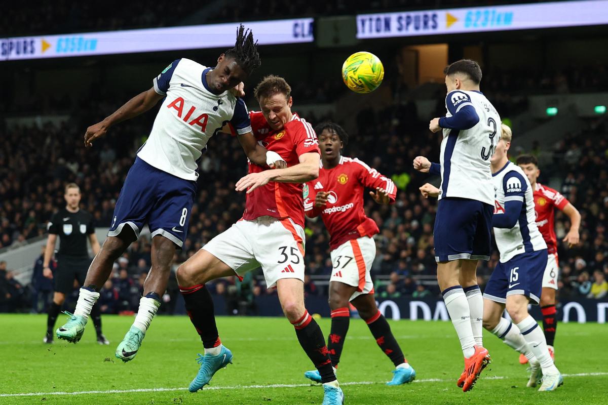 Manchester United's Jonny Evans scores their third goal 