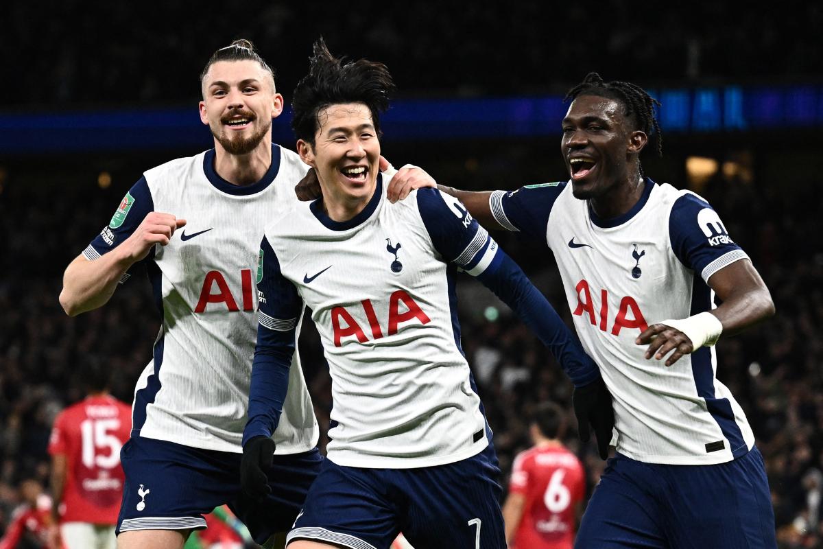 Tottenham Hotspur's Son Heung-min celebrates with Radu Dragusin and Yves Bissouma on scoring the winner against Manchester United at Tottenham Hotspur Stadium, London, Britain on Thursday