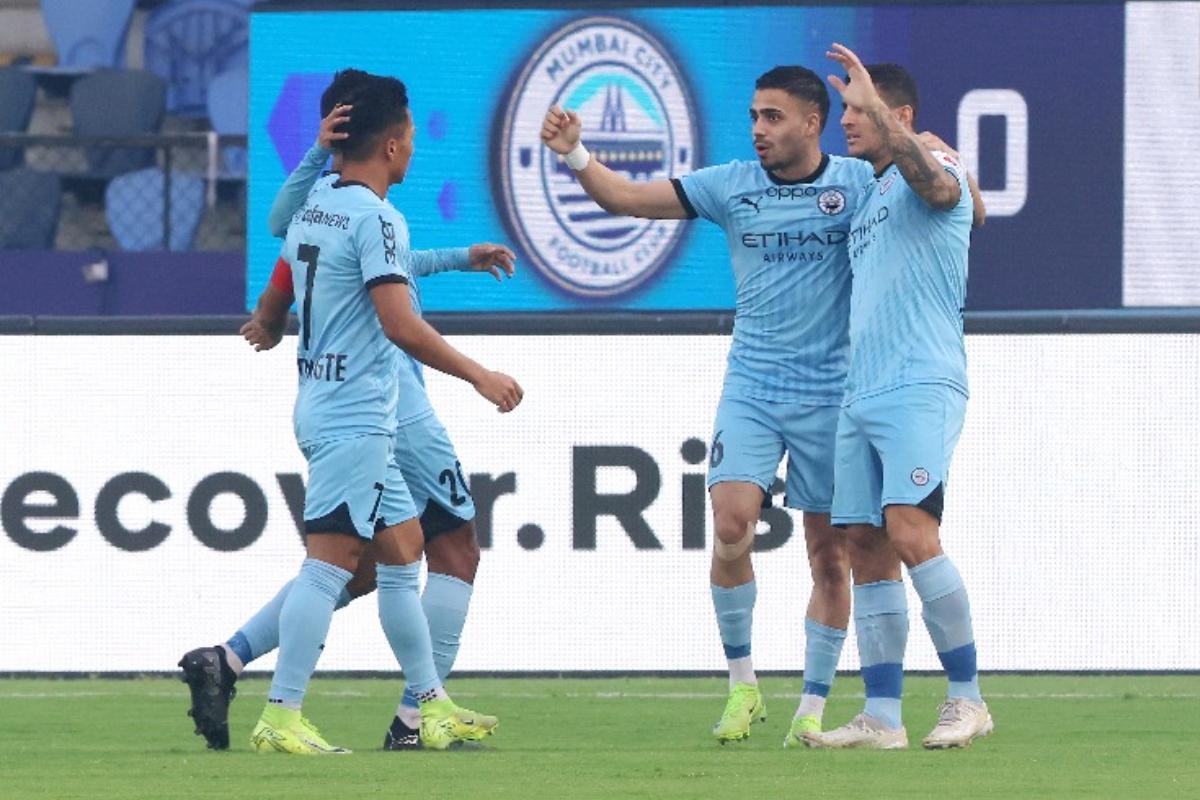 Mumbai City FC players celebrate after Nikolaos Karelis scores against Chennaiyin FC in Mumbai on Saturday