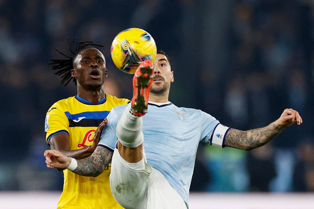 Lazio's Mattia Zaccagni in action with Atalanta's Odilon Kossounou