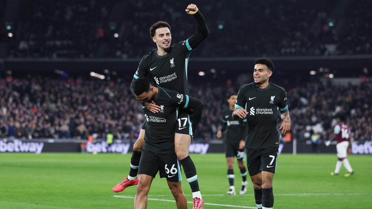 Trent Alexander-Arnold celebrates scoring Liverpool's fourth goal with Curtis Jones and Luis Diaz.