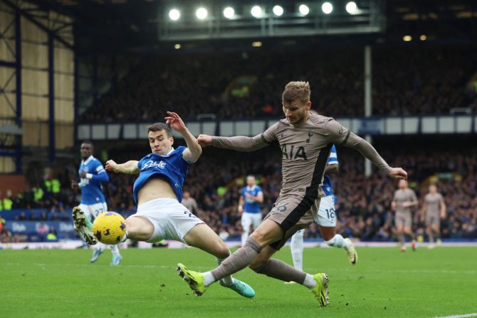 Tottenham Hotspur's Timo Werner is challenged by Everton's Seamus Coleman