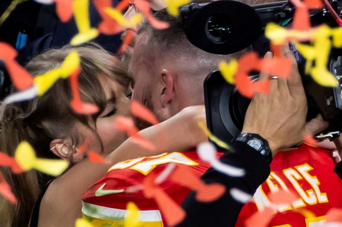 Kansas City Chiefs' Travis Kelce kisses partner Taylor Swift as they celebrate after Kansas City Chiefs win Super Bowl LVIII at Allegiant Stadium, Las Vegas, Nevada, United States, on Sunday