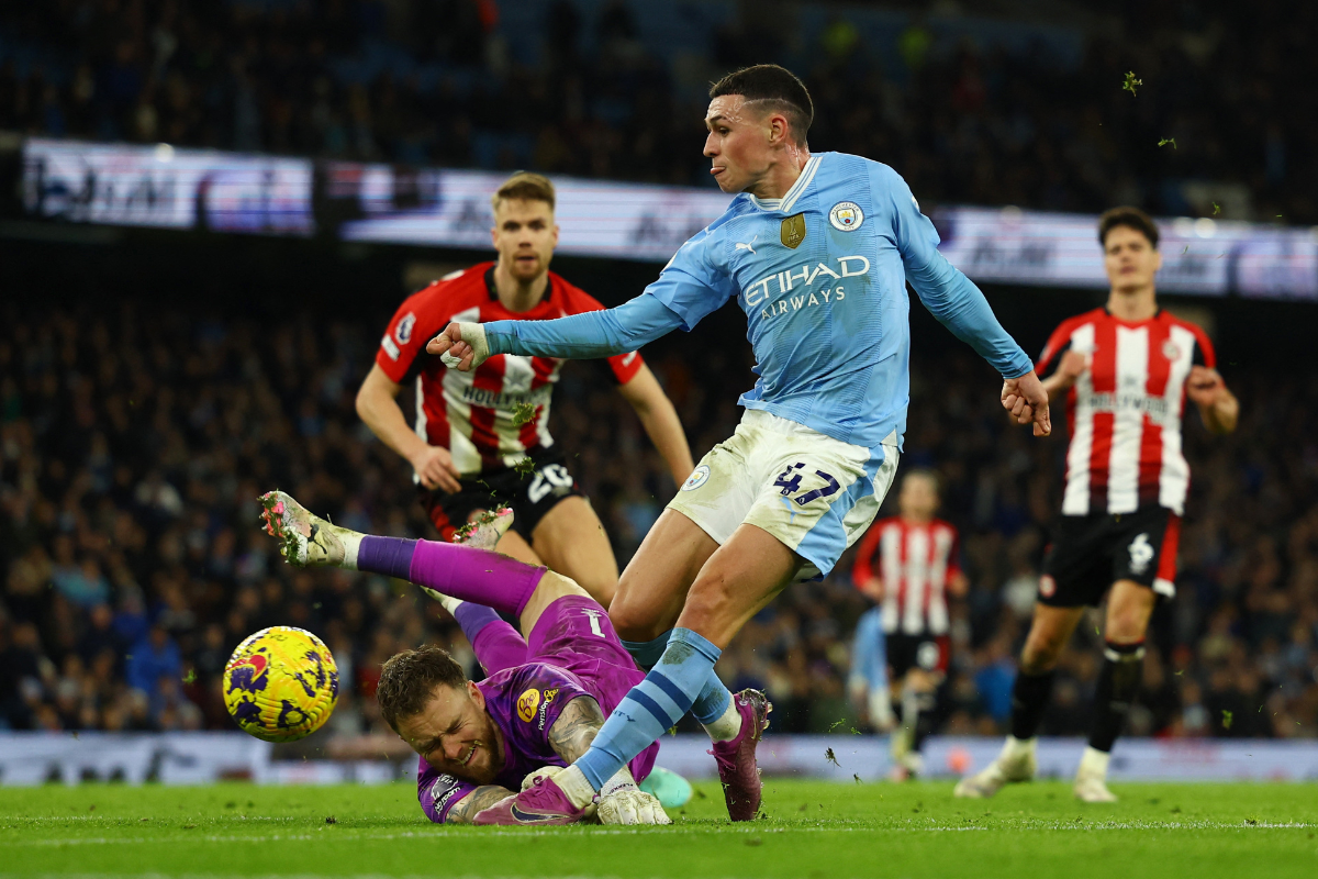 Brentford's Mark Flekken saves an effort from Manchester City's Phil Foden