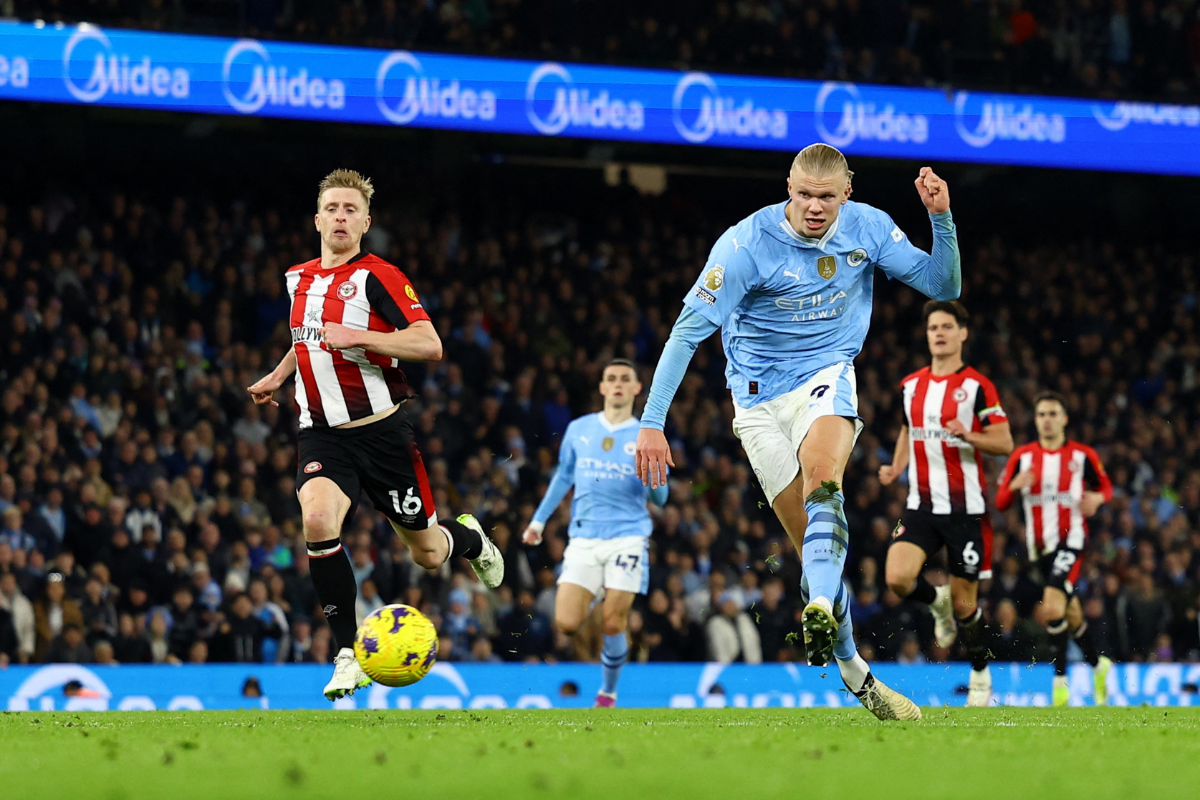 Manchester City's Erling Braut Haaland scores their first goal