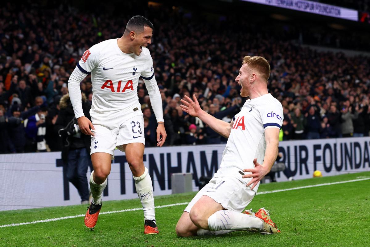 Tottenham Hotspur's Pedro Porro celebrates scoring their first goal with Dejan Kulusevski during their FA Cup third round match against Burnley at Tottenham Hotspur Stadium, London, on Friday