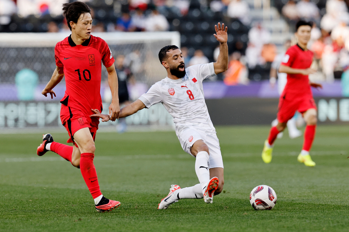 Bahrain's Mohamed Marhoon in action with South Korea's Lee Jae-sung during their AFC Asian Cup Group E match at Jassim bin Hamad Stadium, Al Rayyan, Qatar, on Monday