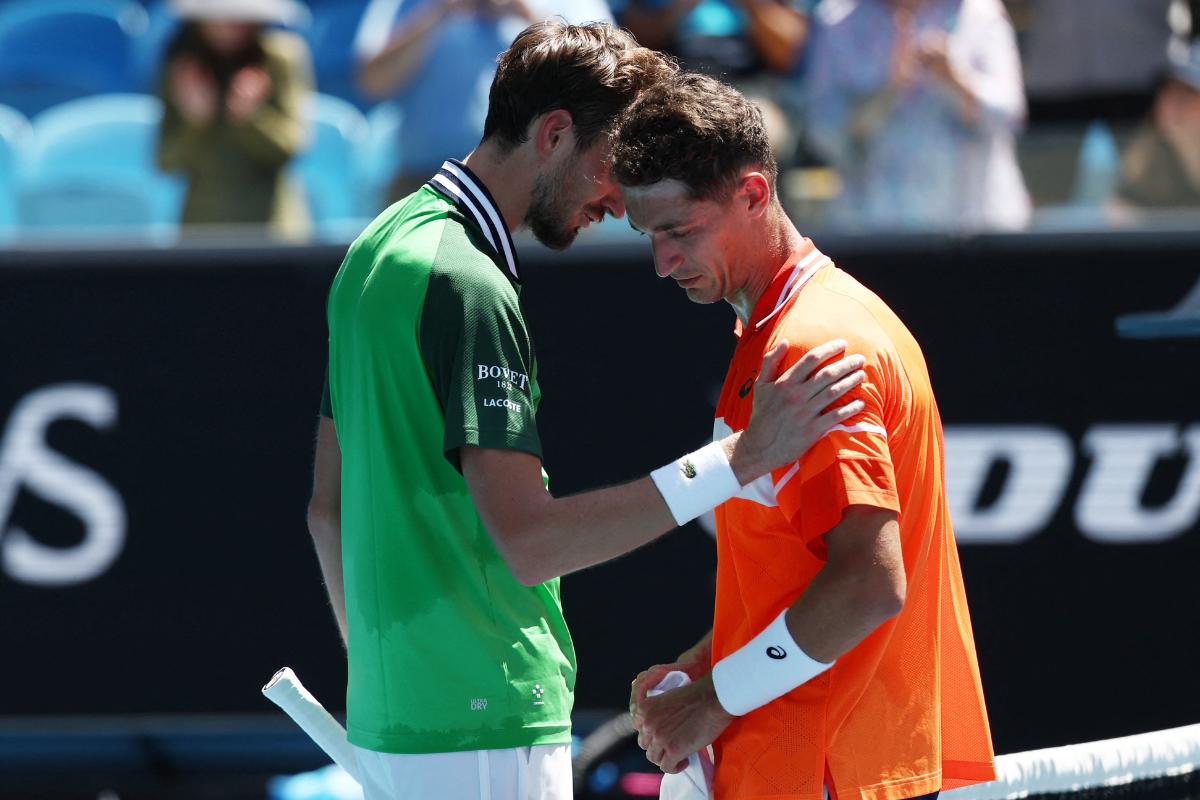 Russia's Daniil Medvedev consoles France's Terence Atmane after the latter retired from their first round match