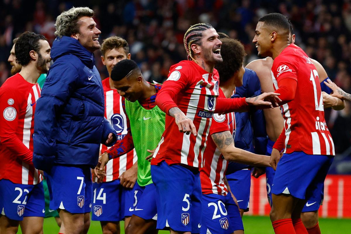 Atletico Madrid's Antoine Griezmann, Rodrigo De Paul and Samuel Lino celebrate with teammates after the match 