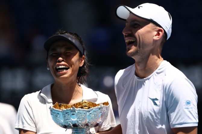 Poland's Jan Zielinski and Taiwan's Hsieh Su-wei pose with the trophy after winning their mixed doubles final match against Britain's Neal Skupski and Desirae Krawczyk of the US