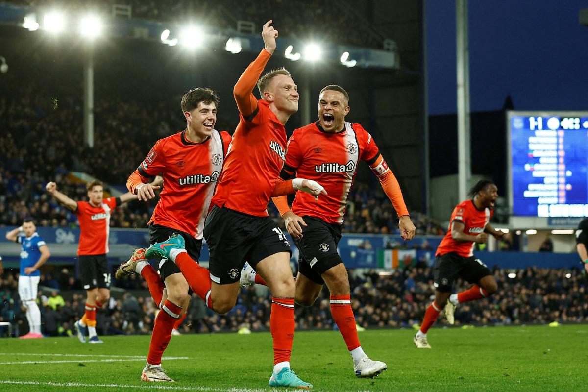 Luton Town's Cauley Woodrow celebrates with Carlton Morris on scoring their second goal against Everton at Goodison Park, Liverpool, on Saturday 