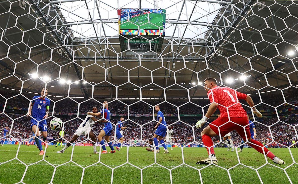 Slovakia's goalkeeper Martin Dubravka can only watch as Jude Bellingham's equalizer in the 95th minute crashes into the net