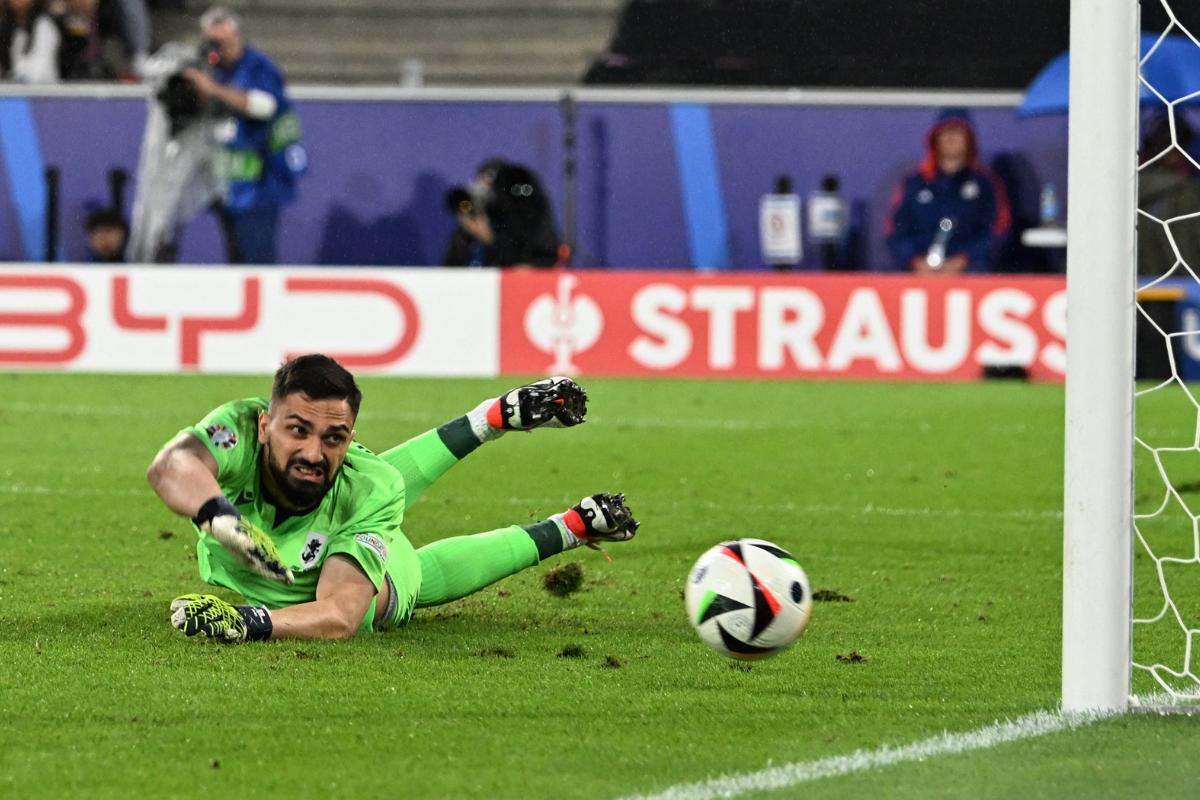 Georgia's Giorgi Mamardashvili reacts in agony as Spain's Rodri scores their first goal during their Round of 16 match at Cologne Stadium, Cologne, Germany, on Monday