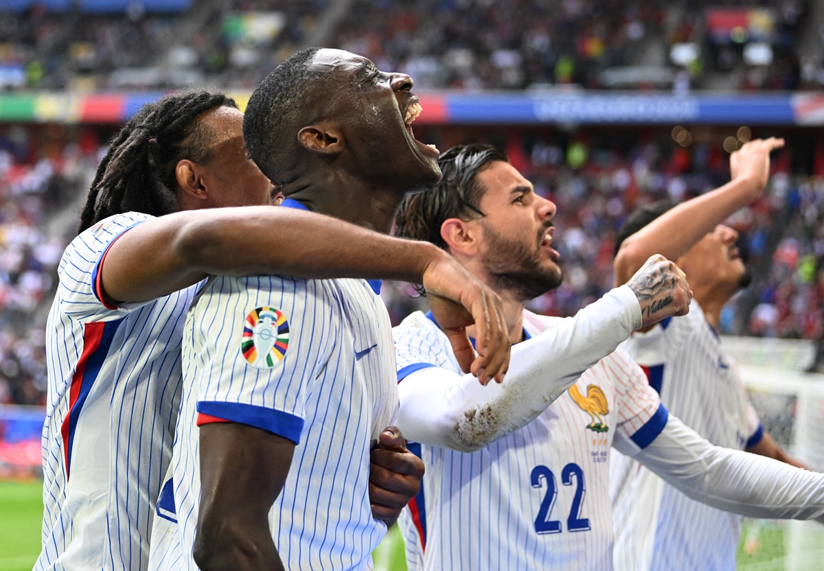 Randal Kolo Muani celebrates scoring with his France teammates Jules Kounde and Theo Hernandez.