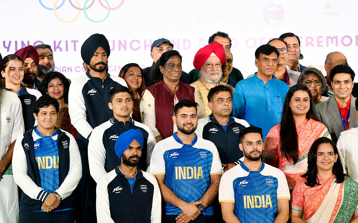 Union Sports and Youth Affairs Minister Mansukh Mandaviya, Union Minister of Petroleum and Natural Gas Hardeep Singh Puri and Indian Olympic Association (IOA) President PT Usha with athletes during the sendoff ceremony for Paris 2024 Olympics, in New Delhi on Sunday.