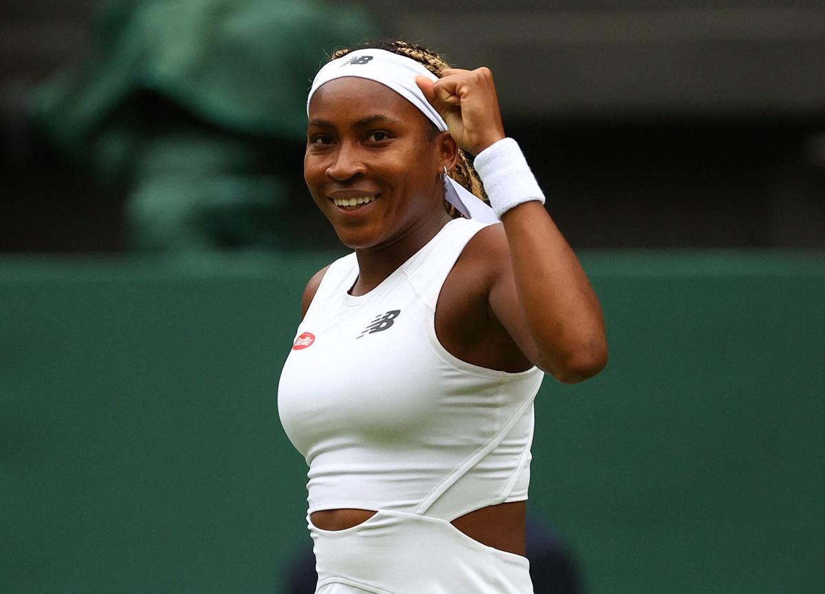 Coco Gauff of the United States celebrates winning her first round match against compatriot Caroline Dolehide.