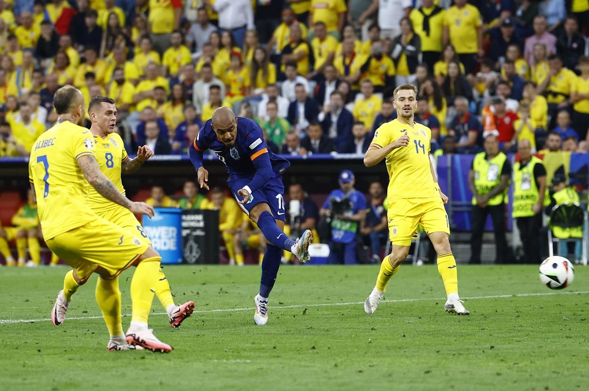 Donyell Malen scores the Netherlands' third goal and his second in the Euro 2024 Round of 16 match, at Munich Football Arena, Germany, on Tuesday.