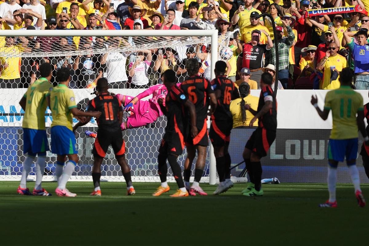 Brazil midfielder Raphinha (No. 11) watches his free-kick sail over the Colombia wall and crash into the net during the Copa America match at Levi's stadium, Santa Clara, USA.