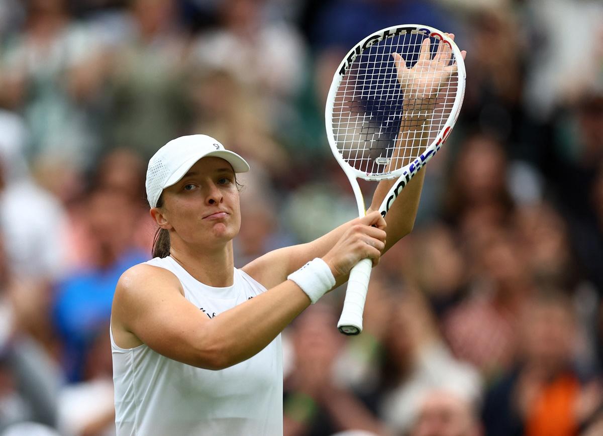 Poland's Iga Swiatek celebrates winning her first round match against Sofia Kenin of the United States.