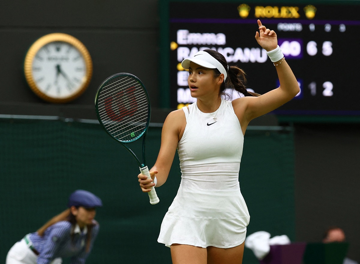 Britain's Emma Raducanu celebrates winning her second round match against Belgium's Elise Mertens.